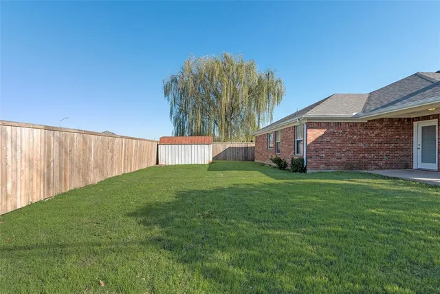 a view of a backyard with a garden