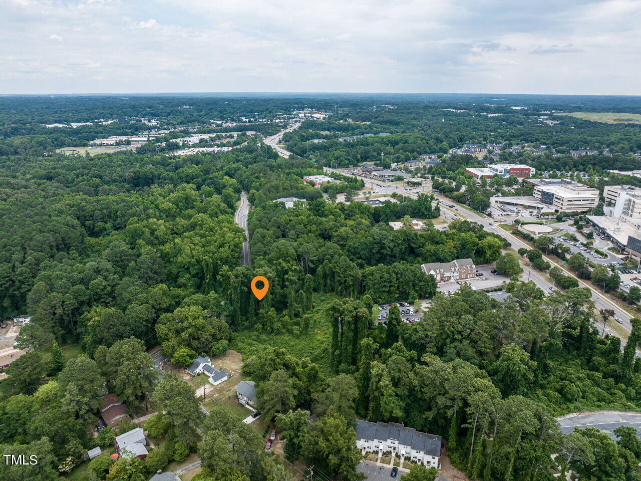 2802 Milburnie Road Raleigh, NC 27610 - Photo 5 of 9 an aerial view of a city with lots of residential buildings