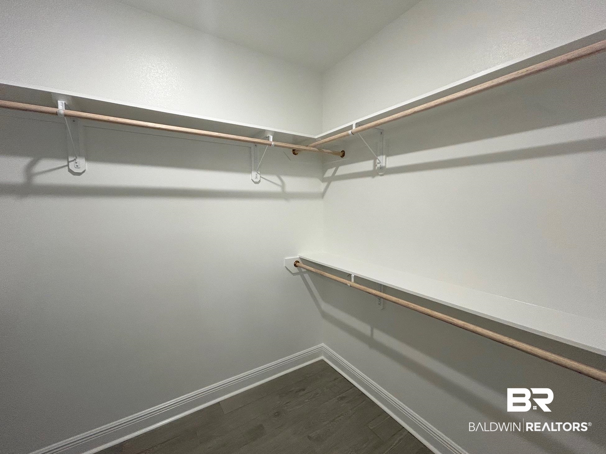 881 Sumter Loop Foley, AL 36535 - Photo 10 of 19 Walk in closet featuring dark hardwood / wood-style flooring