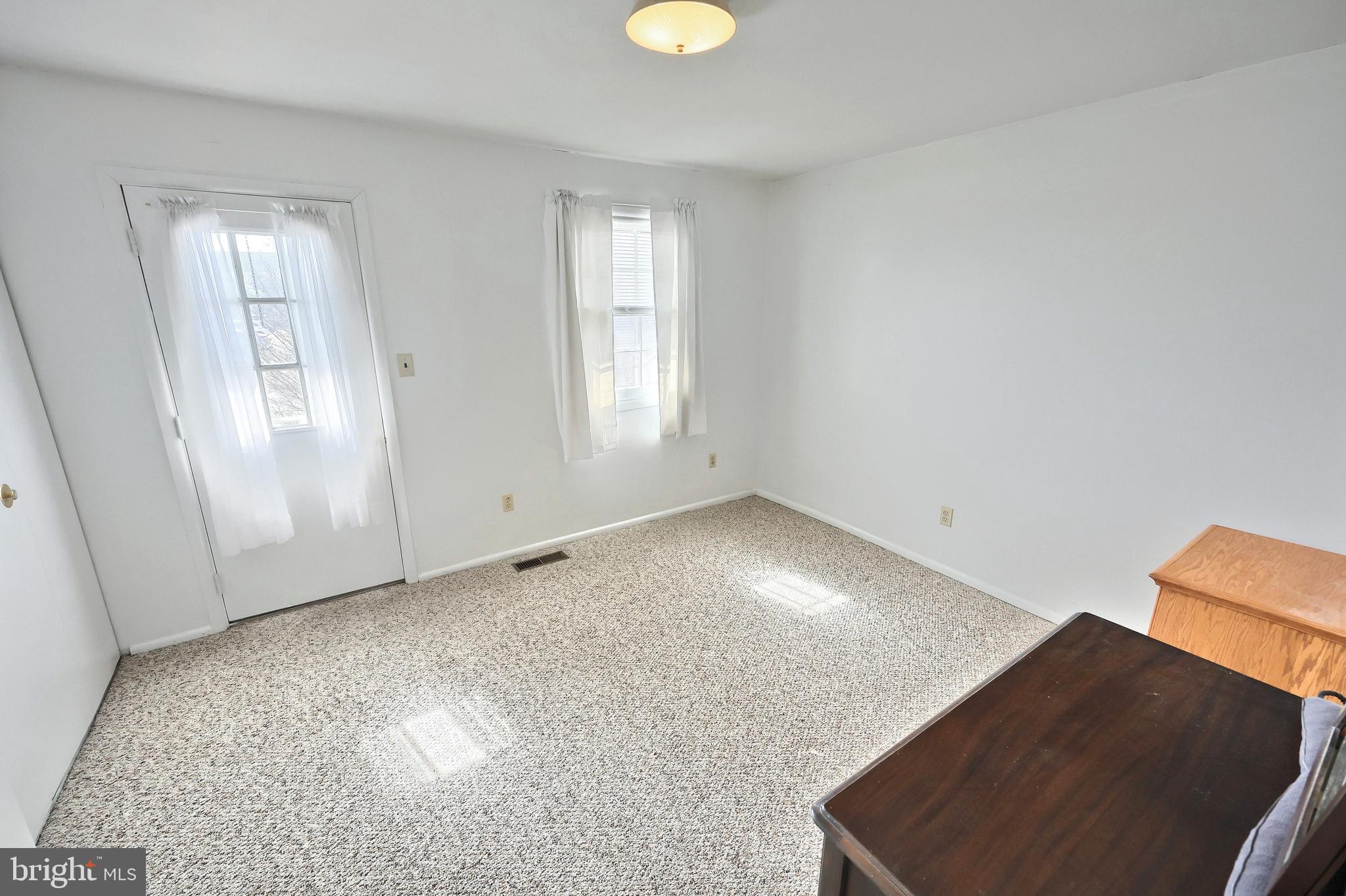 1640 Devers Road, Unit D York, PA 17404 - Photo 17 of 22 wooden floor in an empty room with a window