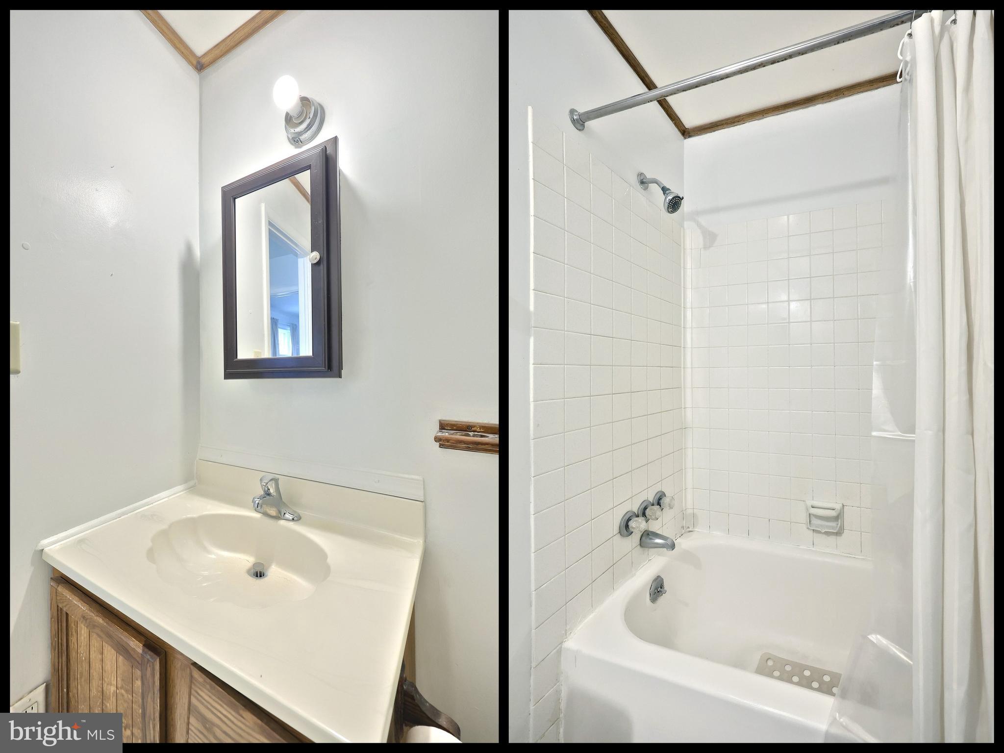 1640 Devers Road, Unit D York, PA 17404 - Photo 22 of 22 a bathroom with a white bath tub sitting next to a white sink and mirror