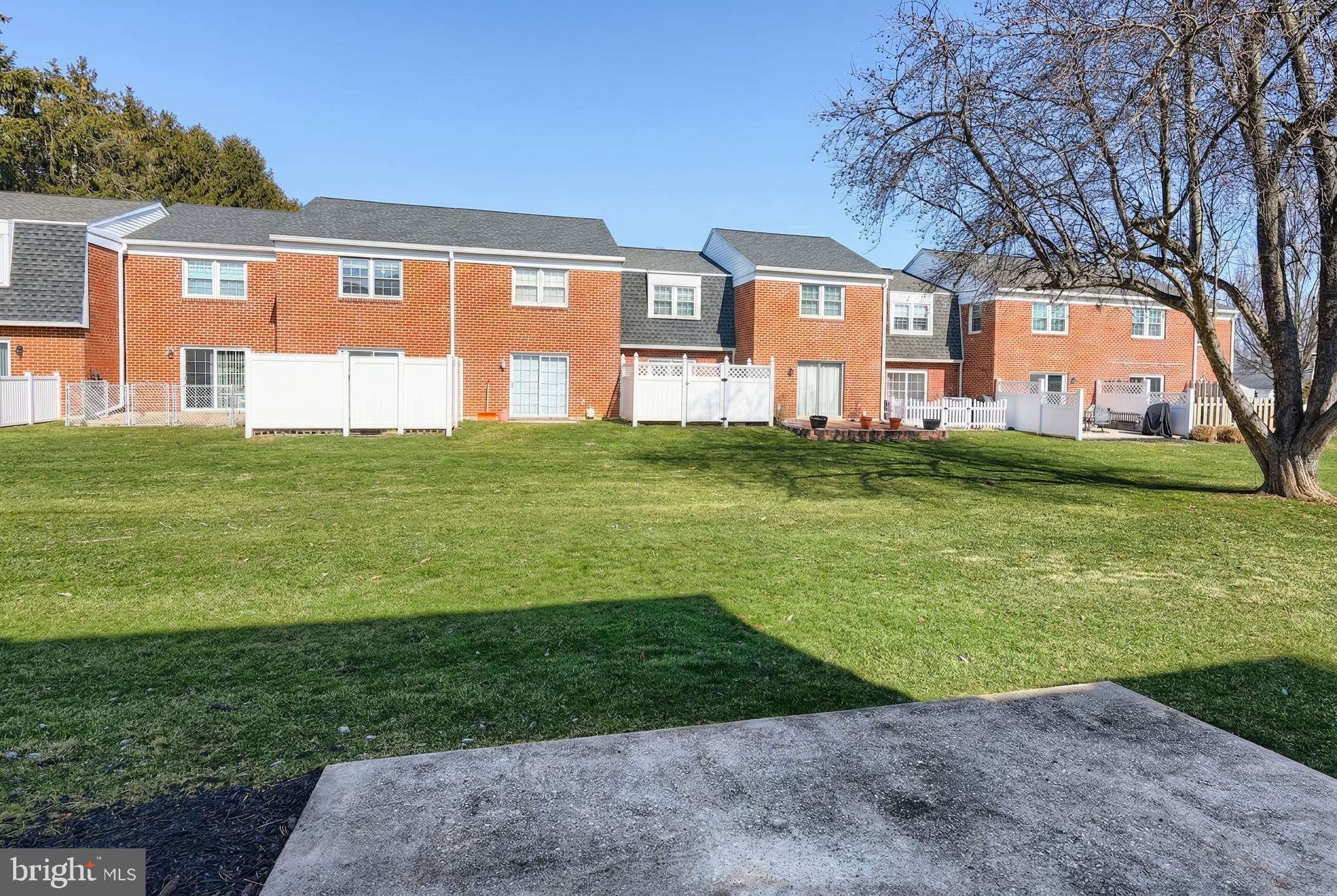 1640 Devers Road, Unit D York, PA 17404 - Photo 4 of 22 a view of a big house with a big yard and large trees