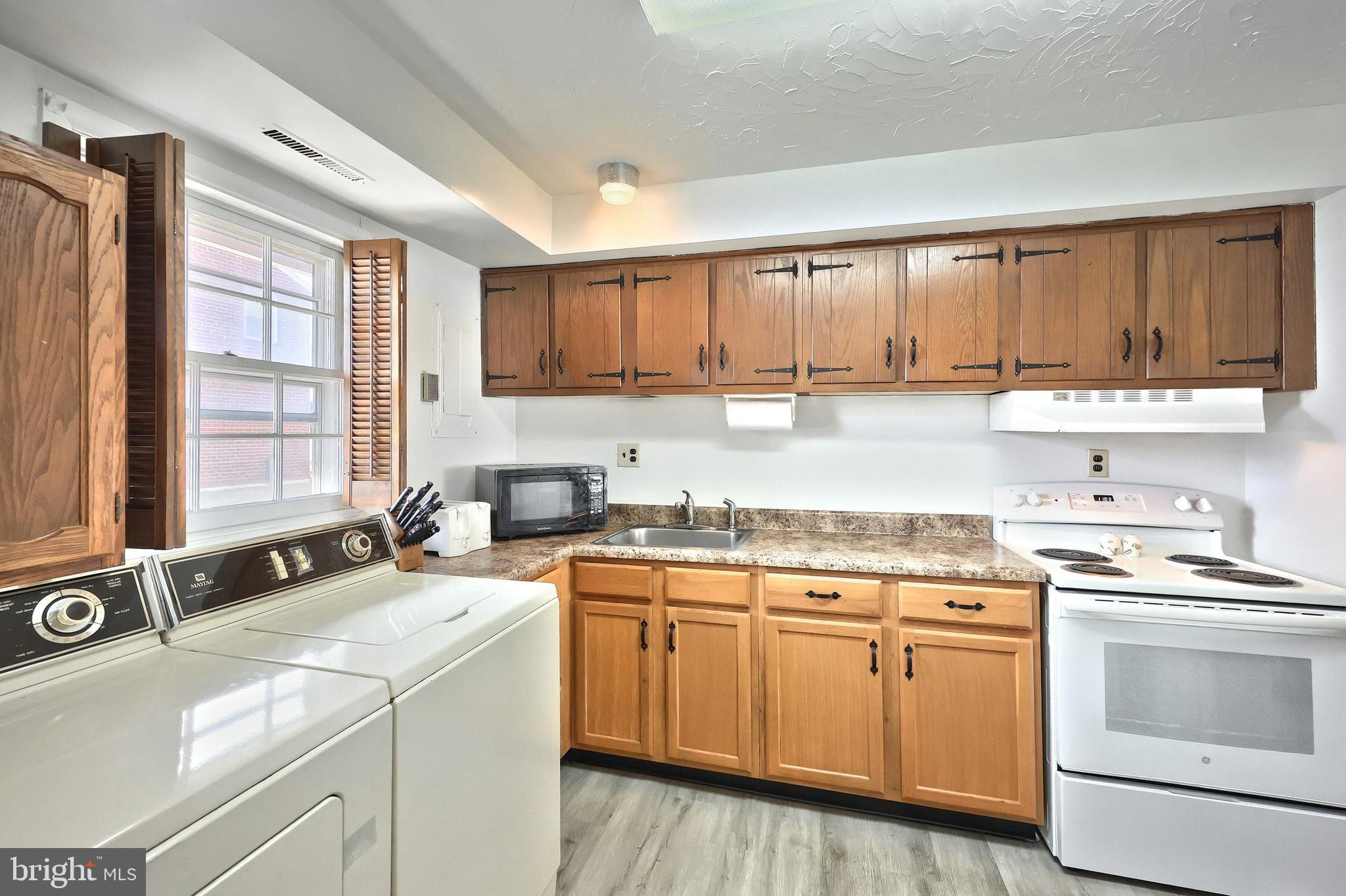 1640 Devers Road, Unit D York, PA 17404 - Photo 9 of 22 a kitchen with a sink stove top oven and cabinets
