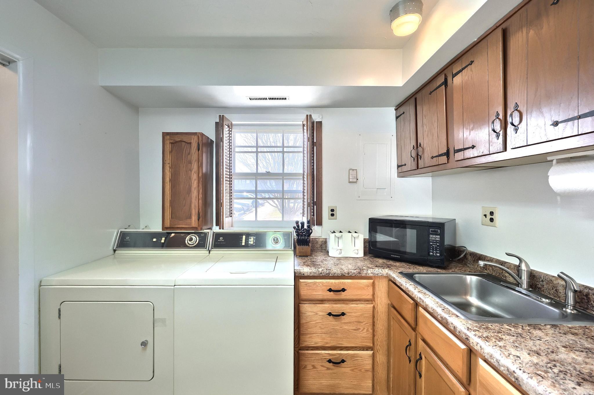 1640 Devers Road, Unit D York, PA 17404 - Photo 10 of 22 a kitchen with granite countertop a sink stove top oven and cabinets