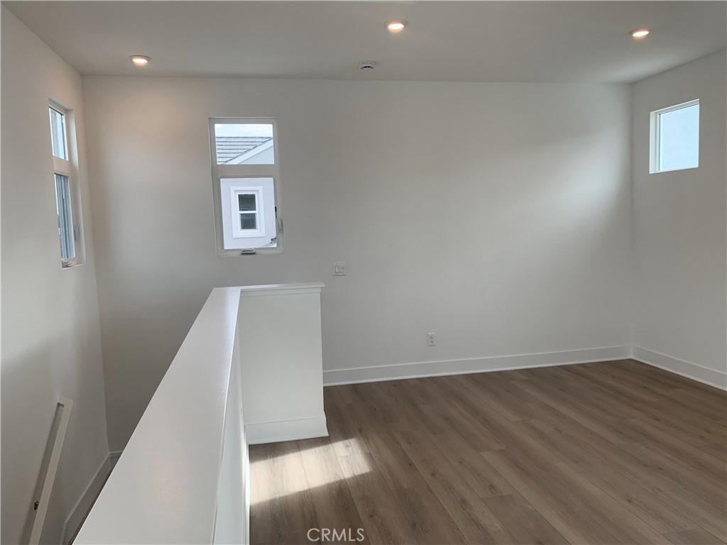 218 Abacus Irvine, CA 92618 - Photo 26 of 30 an empty room with wooden floor