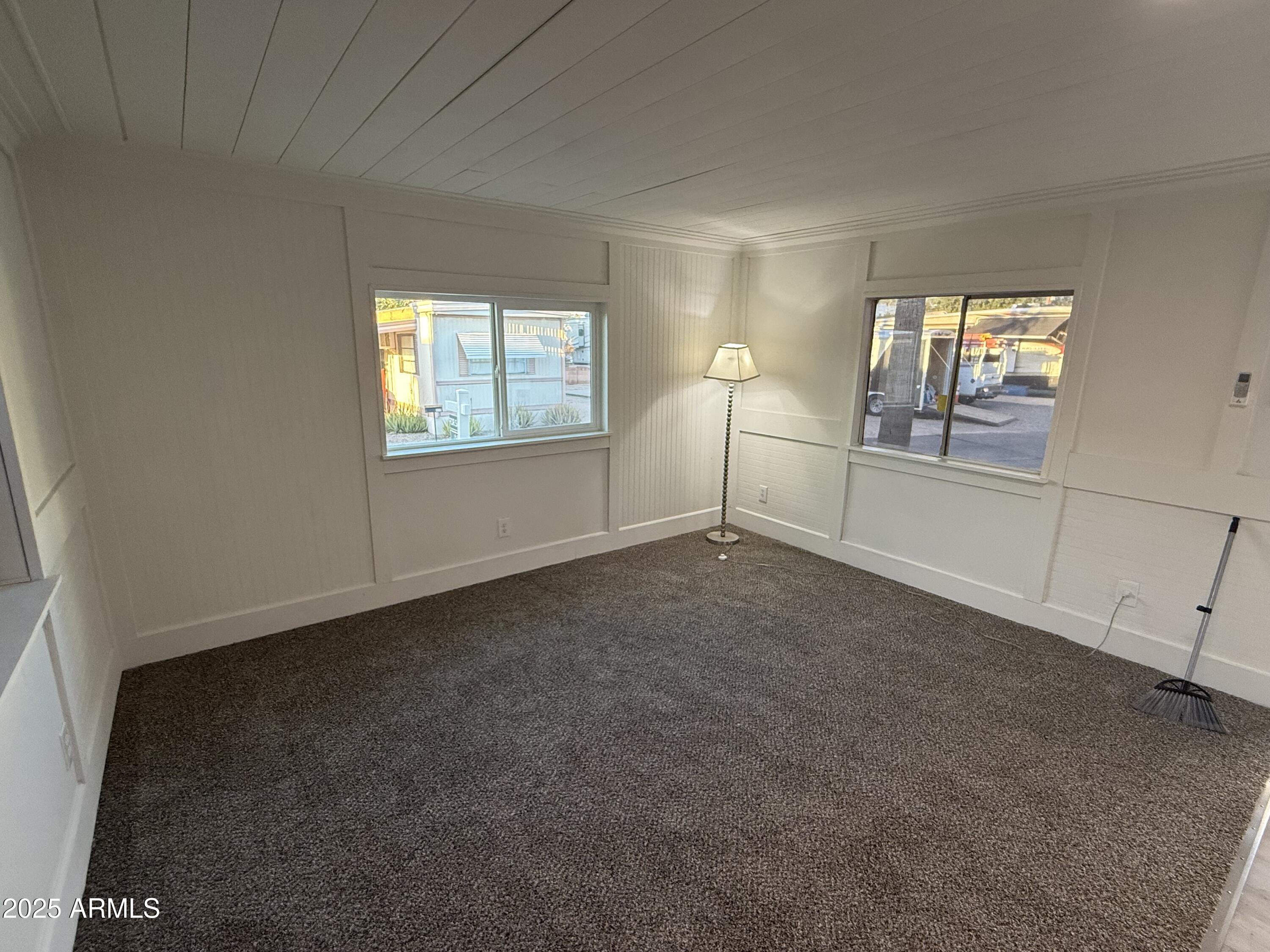 16005 North 32nd Street, Unit 66 Phoenix, AZ 85032 - Photo 5 of 7 an empty room with windows