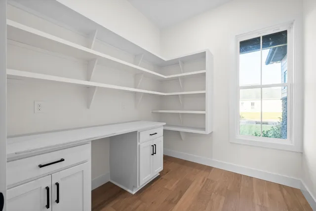 a room with a furniture and a window