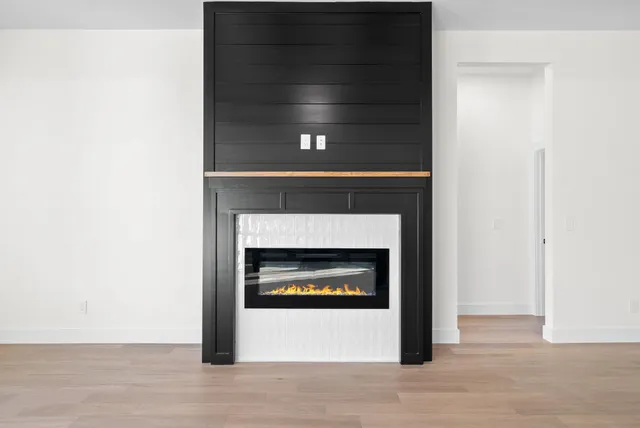 a an empty room with a fireplace