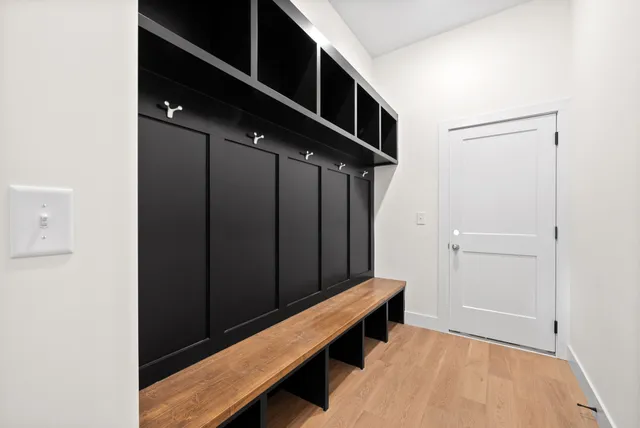 a bathroom with a double vanity sink mirror and bathtub
