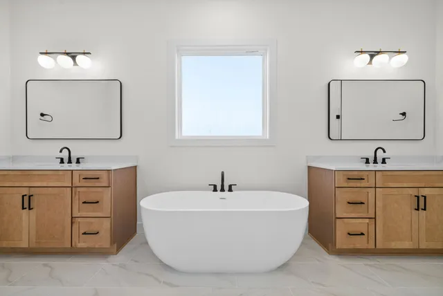 a bathroom with a bathtub and a sink