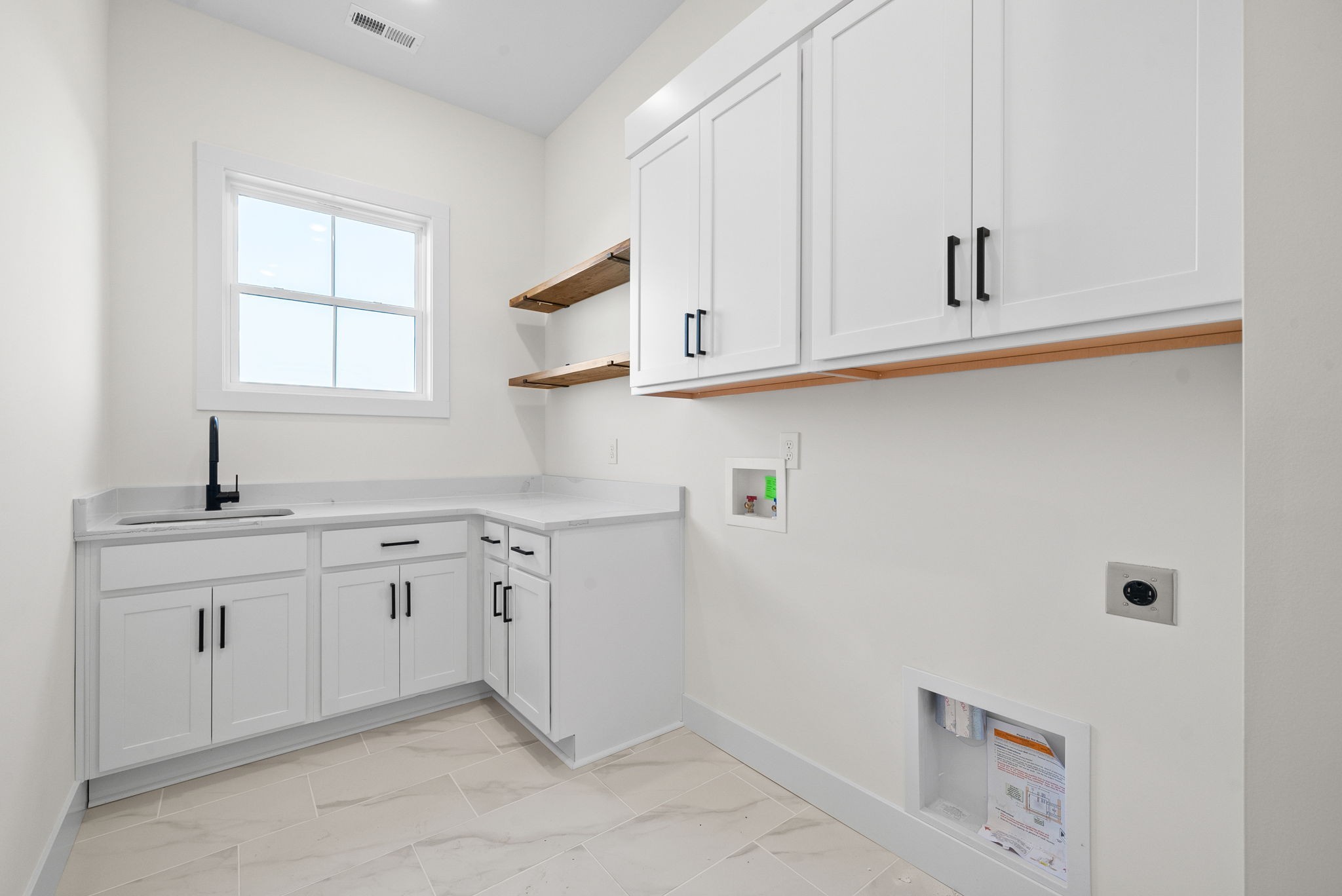 1120 Jacobs Court Joelton, TN 37080 - Photo 29 of 44 a kitchen with white cabinets and sink