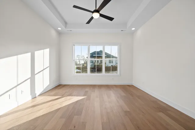 a bathroom with a double vanity sink a mirror and a bathtub