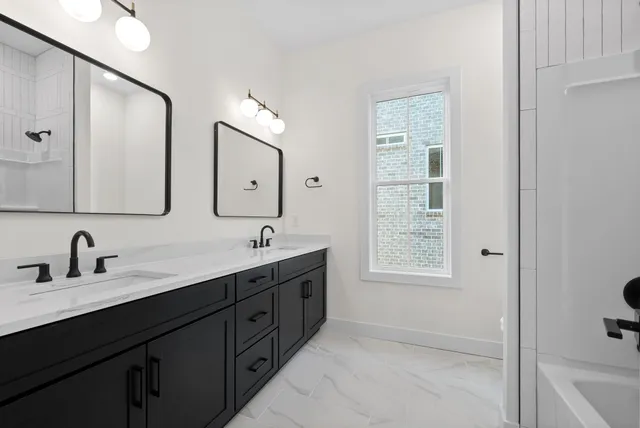 a bathroom with a bathtub and a toilet