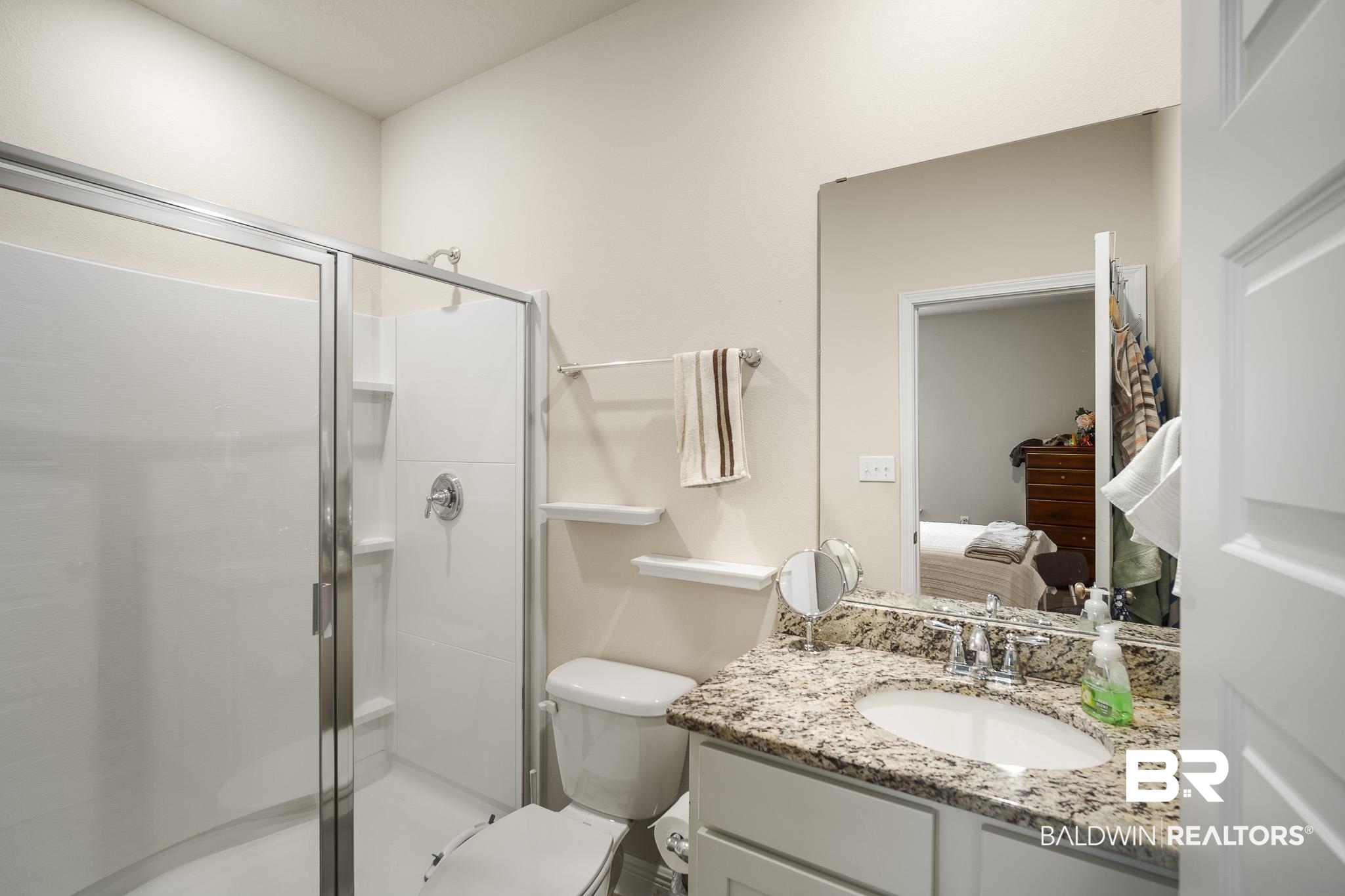 24765 Spectacular Bid Loop Daphne, AL 36526 - Photo 33 of 45 Bathroom featuring vanity, a shower with shower door, and toilet