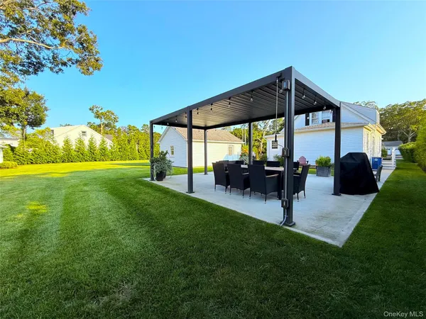 a view of yard with patio