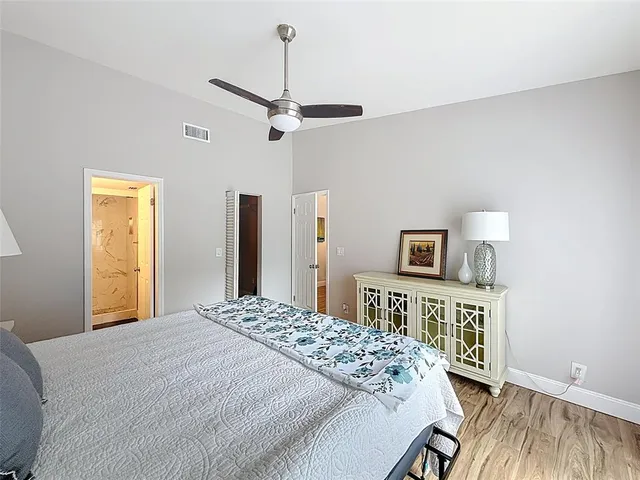 a bedroom with a bed and a tv