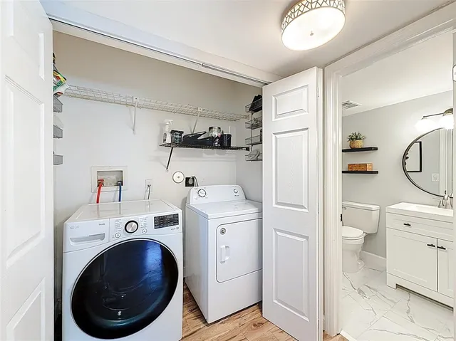 a view of a storage & utility room with washer and dryer
