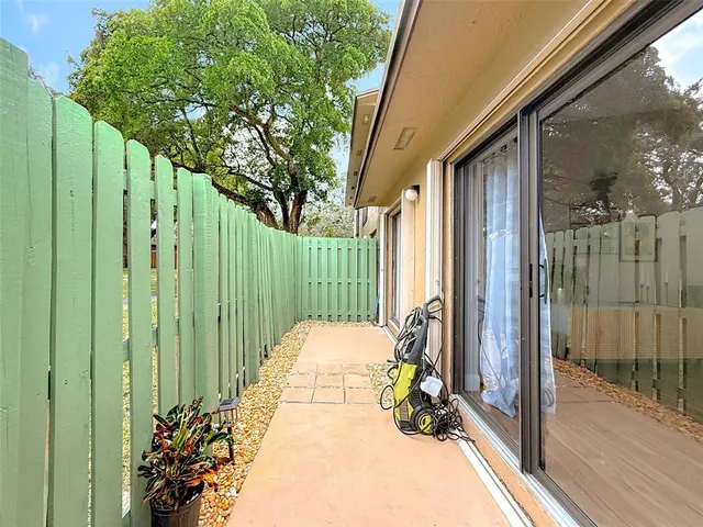a view of a balcony with chairs