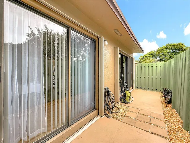 a view of a backyard with a potted plant