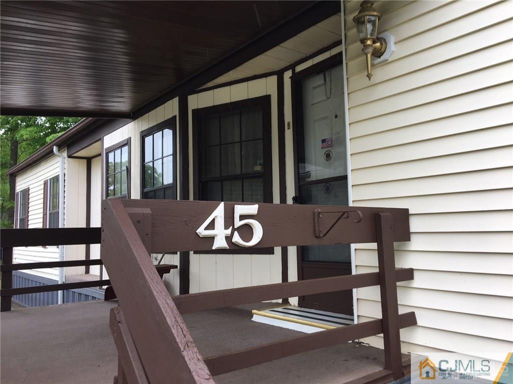45 Burns Road, Unit 45 North Brunswick, NJ 08902 - Photo 3 of 21 a view of backyard with a deck