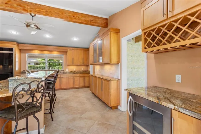 a view of a dining room and livingroom with furniture window and wooden floor