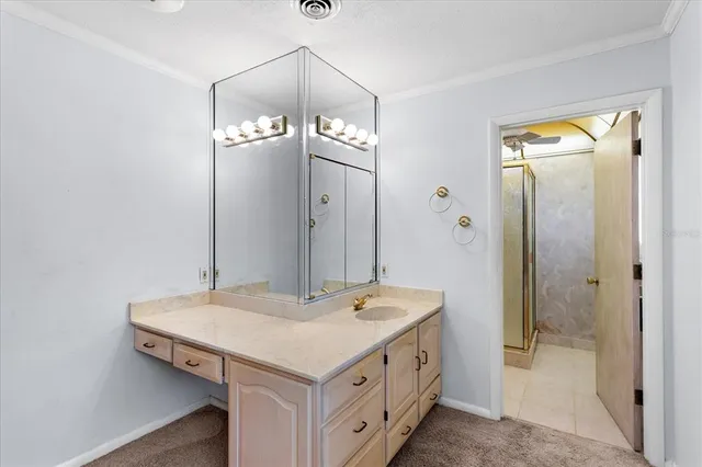 an empty room with window and ceiling fan