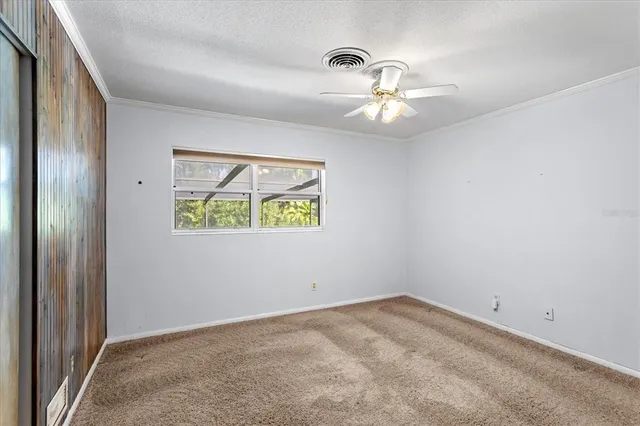 a view of an entryway with wooden floor and door