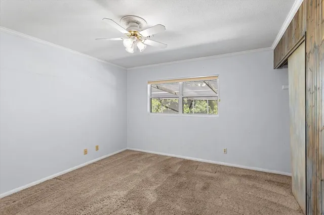 a view of a livingroom with fireplace and a window