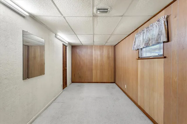 a view of a backyard with a swimming pool