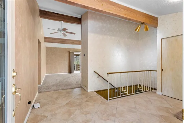 a view of a hallway with staircase