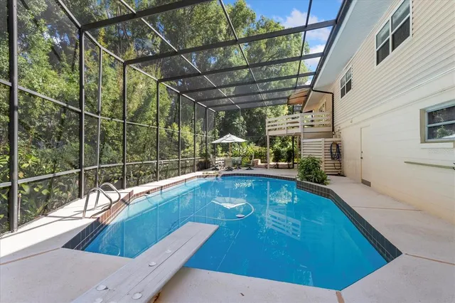 a view of a large house with a tree