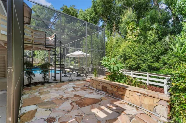 a view of a yard with wooden deck