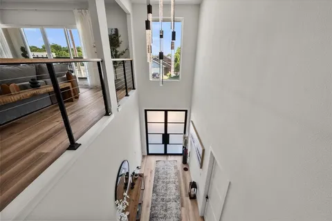 a view of a hallway with furniture and entryway