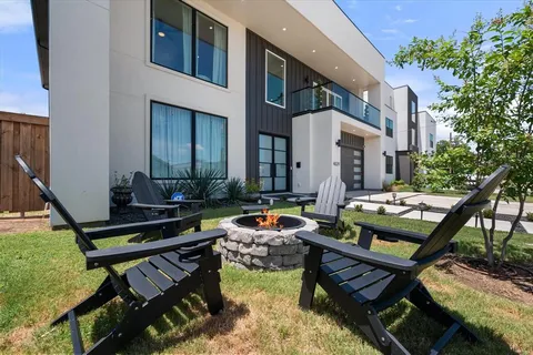 a wooden bench sitting in front of a house