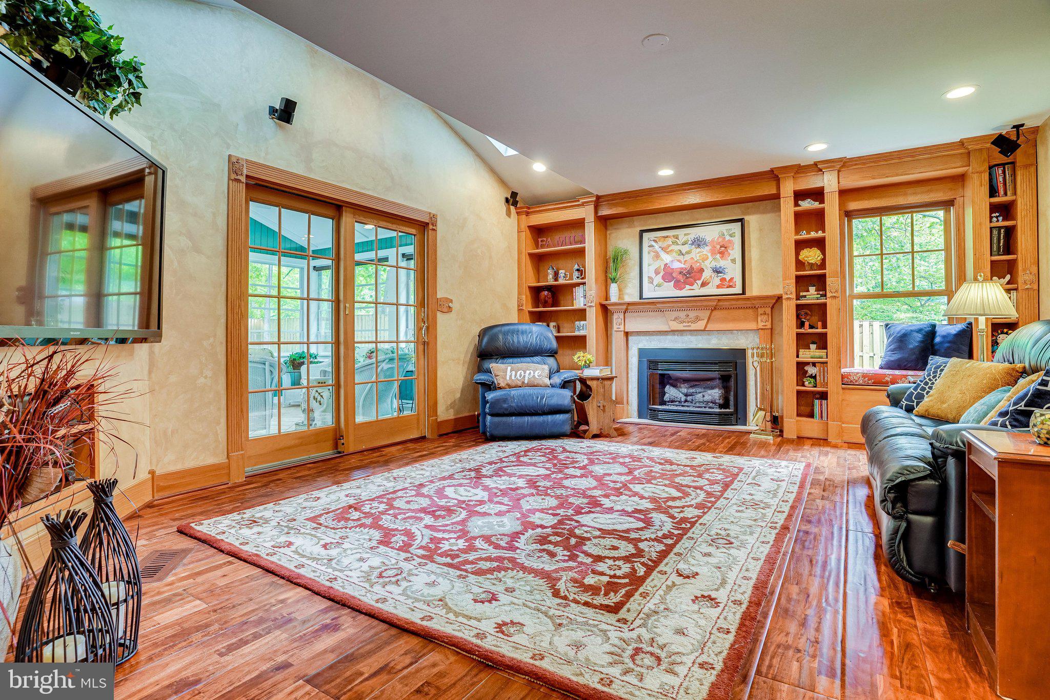 7013 Spur Road Springfield, VA 22153 - Photo 15 of 68 Gas Fireplace flanked by Built In Shelving