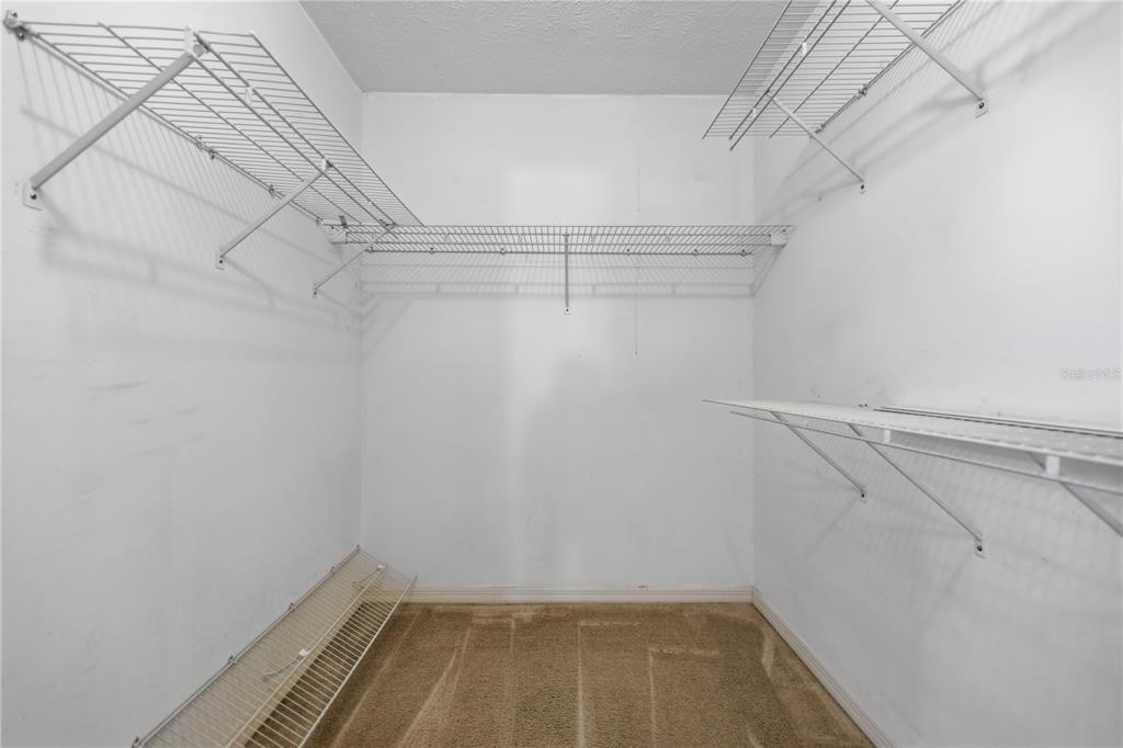 10660 Southwest 73rd Avenue Ocala, FL 34476 - Photo 17 of 37 a view of a room with racks on the wall