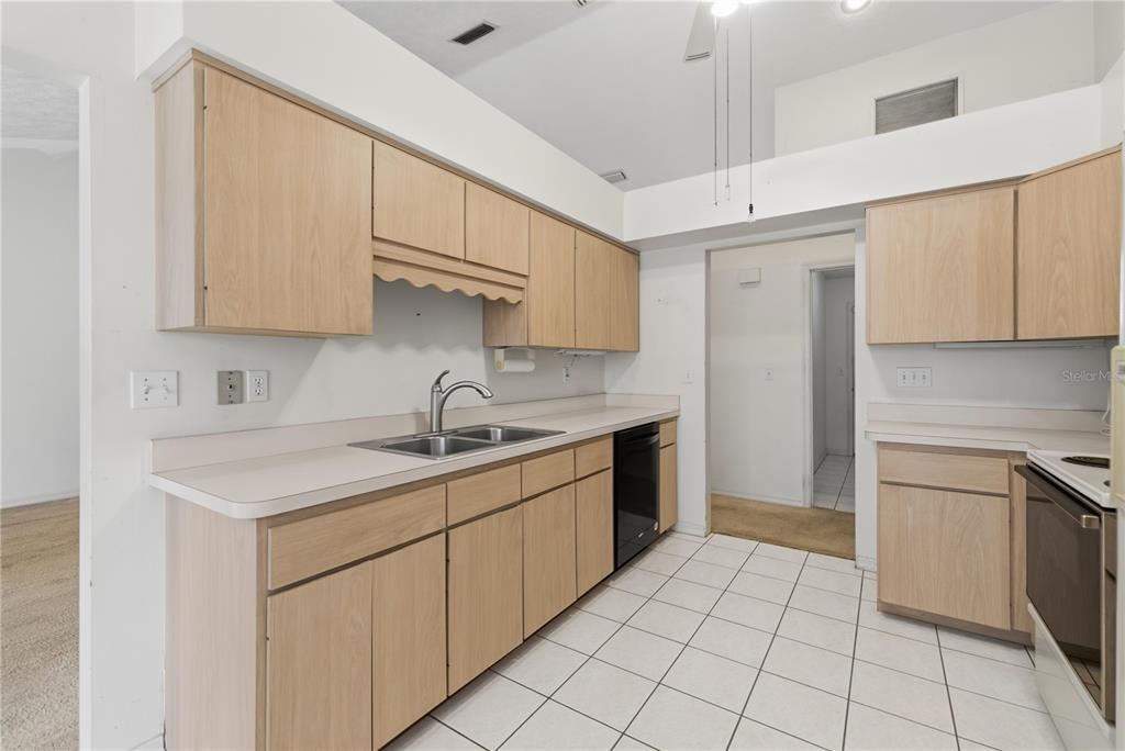 10660 Southwest 73rd Avenue Ocala, FL 34476 - Photo 20 of 37 a kitchen with a sink cabinets and appliances
