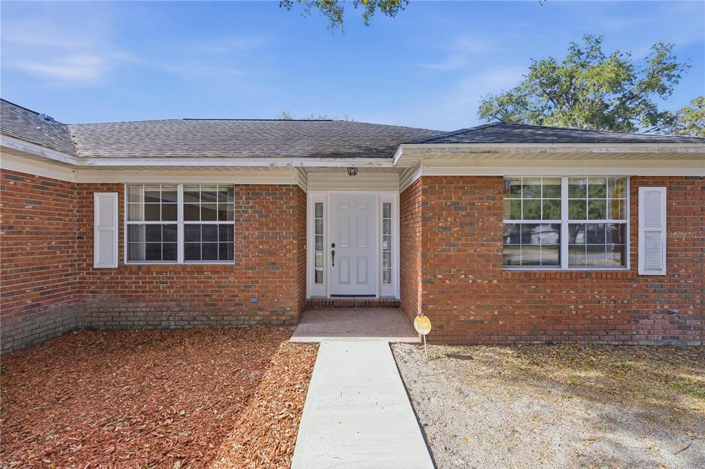 10660 Southwest 73rd Avenue Ocala, FL 34476 - Photo 3 of 37 a front view of a house