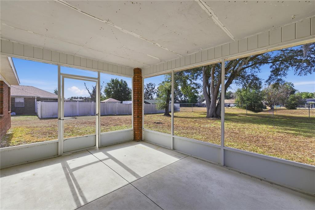 10660 Southwest 73rd Avenue Ocala, FL 34476 - Photo 31 of 37 a view of an empty room with a large window
