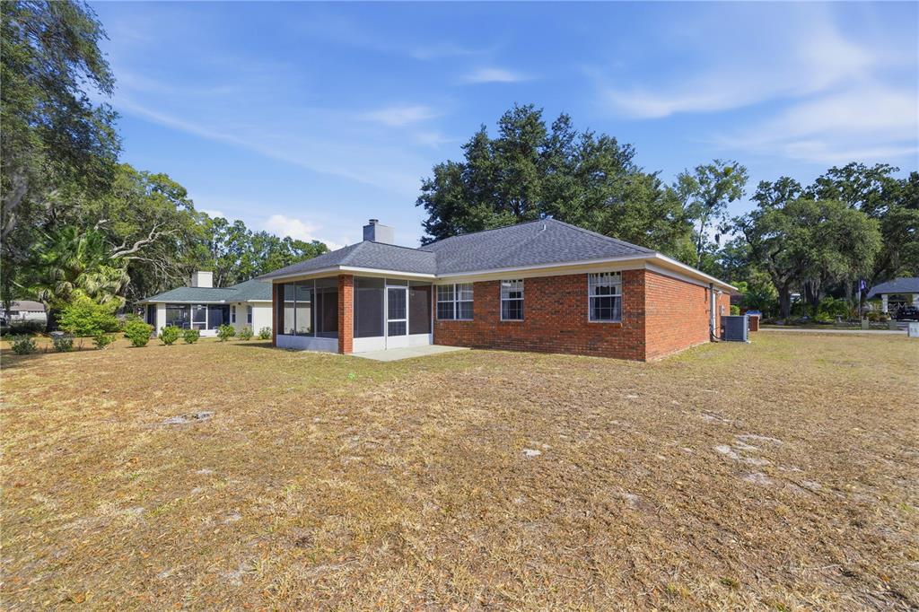 10660 Southwest 73rd Avenue Ocala, FL 34476 - Photo 5 of 37 a front view of a house with a yard