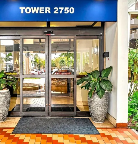 a room with pool table and chairs