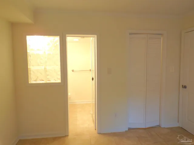 a bathroom with a granite countertop sink toilet and mirror