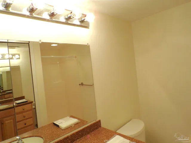 a bathroom with a glass shower door