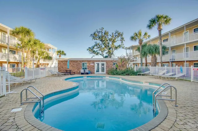 a front view of a house with outdoor seating