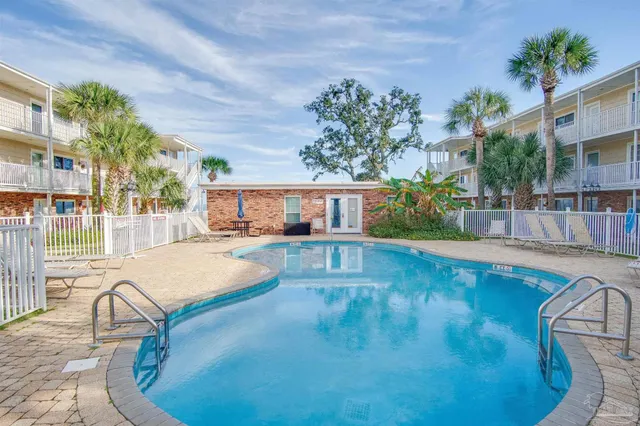 a view of a swimming pool with a patio
