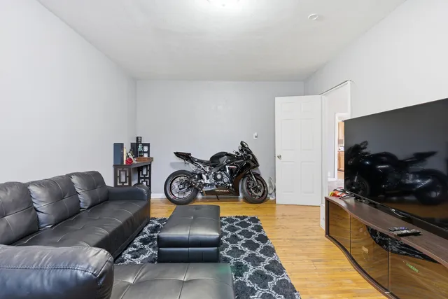 a view of a livingroom with furniture and a flat screen tv