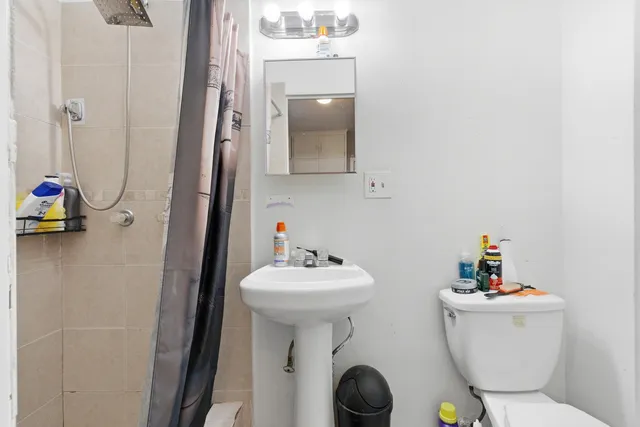 a bathroom with a sink toilet and tub
