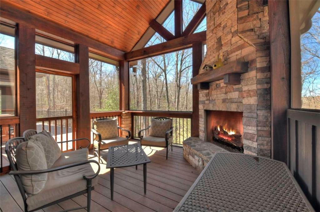 244 Wilderness Way Ellijay, GA 30536 - Photo 21 of 78 a living room with furniture and a fireplace