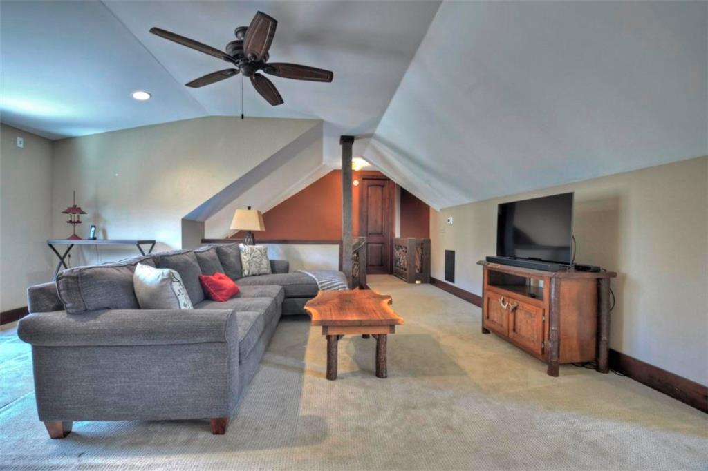244 Wilderness Way Ellijay, GA 30536 - Photo 46 of 78 a living room with furniture and a flat screen tv