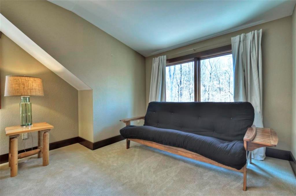 244 Wilderness Way Ellijay, GA 30536 - Photo 47 of 78 a living room with a couch and a large window